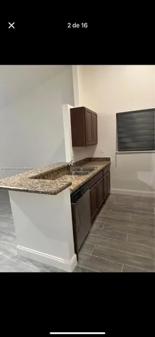 a view of appliances and cabinets