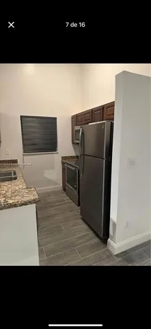 a view of kitchen island with wooden floor