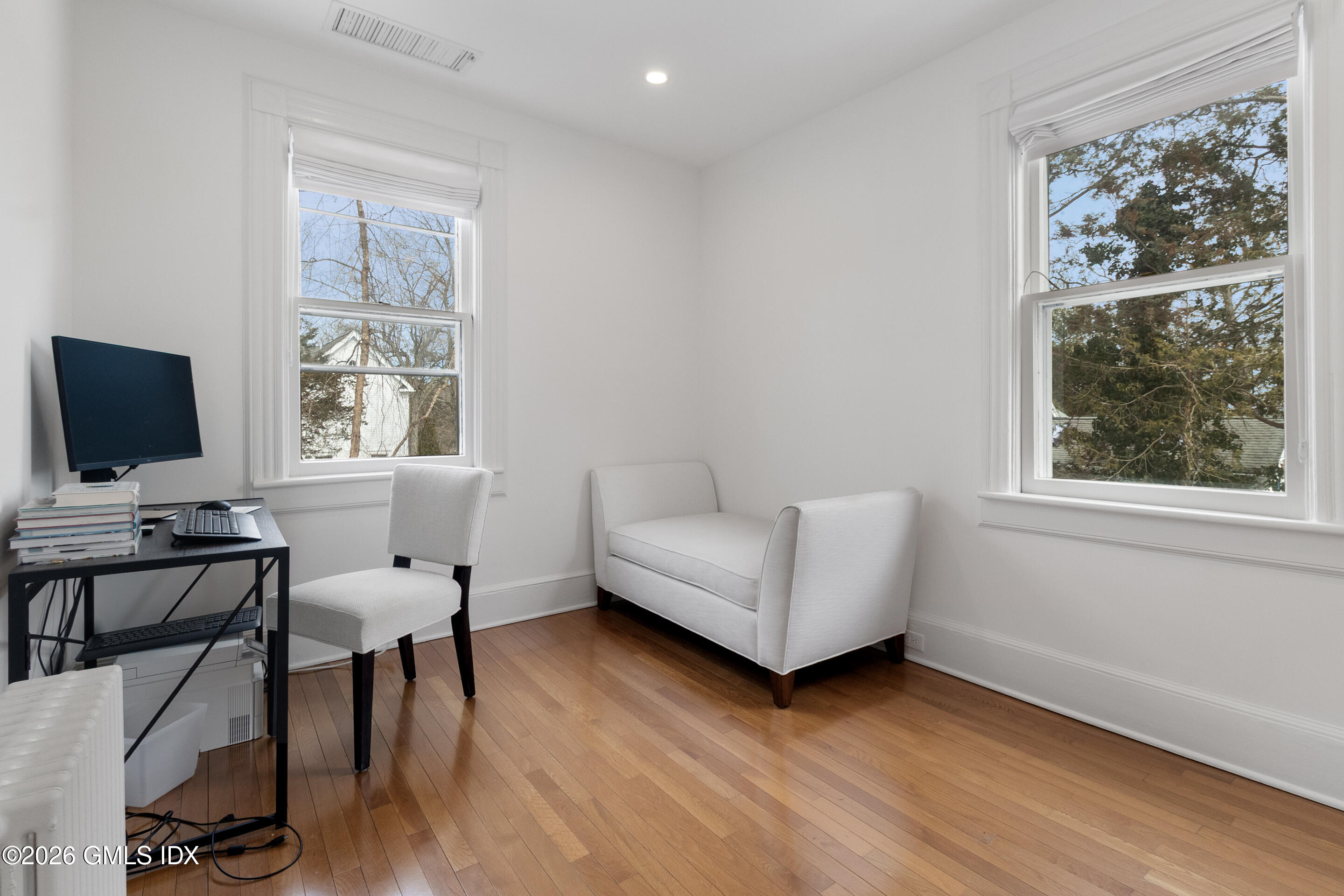 29 Weston Hill Road Riverside, CT 06878 - Photo 21 of 23 a living room with furniture and a flat screen tv