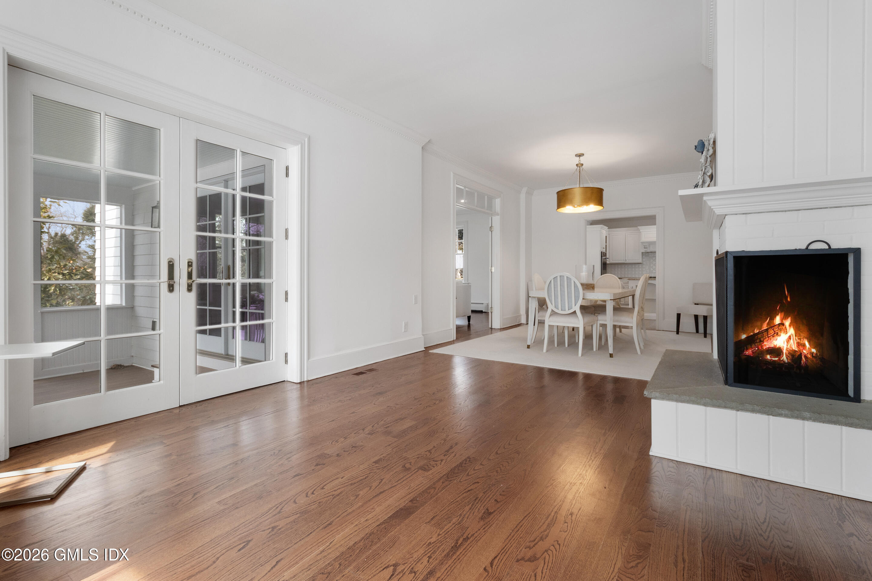 29 Weston Hill Road Riverside, CT 06878 - Photo 8 of 23 a view of a livingroom with furniture a fireplace and wooden floor