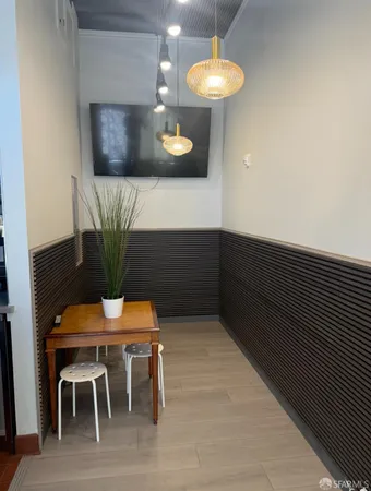 a kitchen with a table and chairs in it