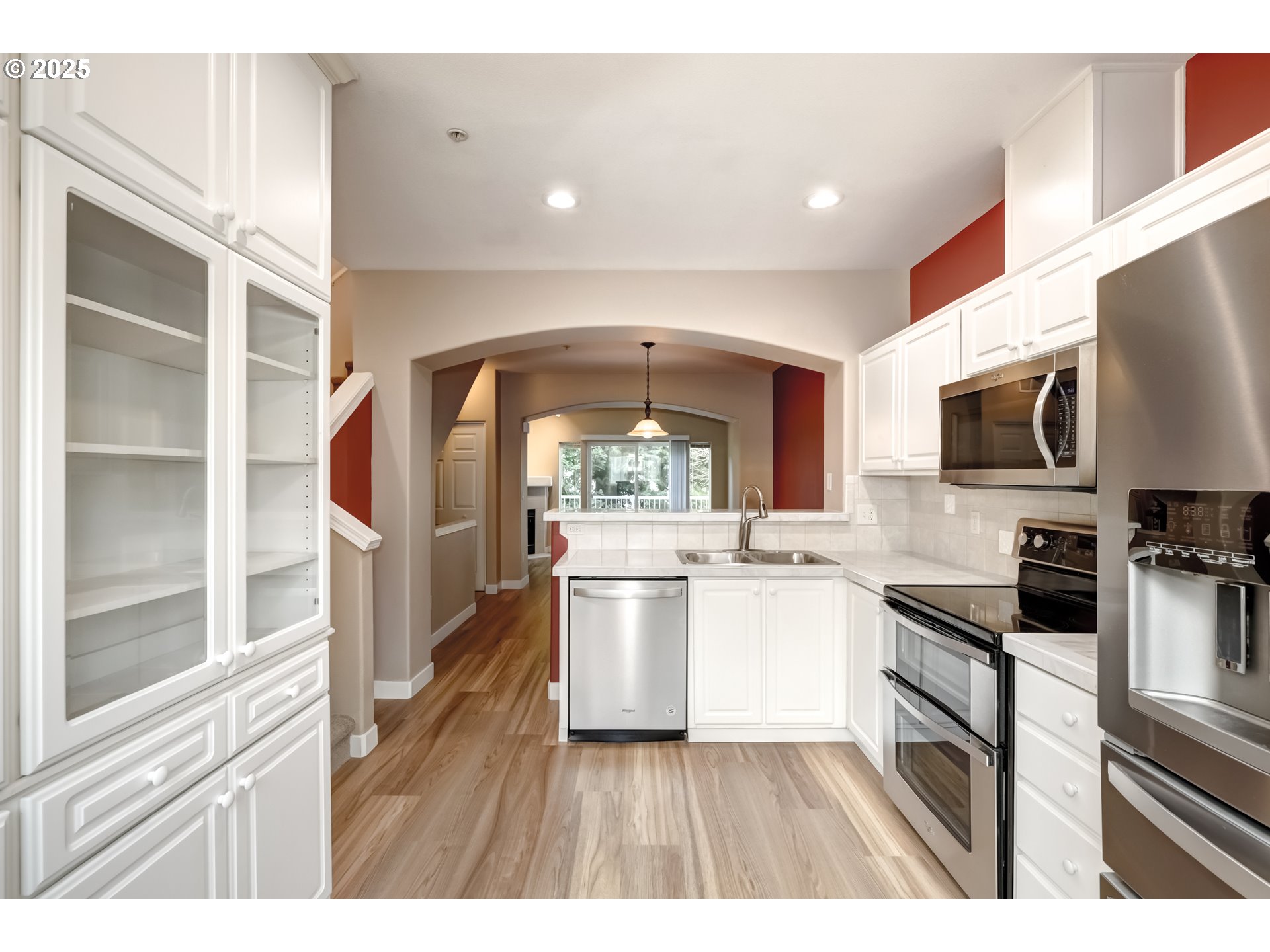 16080 Southwest Audubon Street, Unit 103 Beaverton, OR 97003 - Photo 12 of 24 a kitchen with a sink stove and cabinets