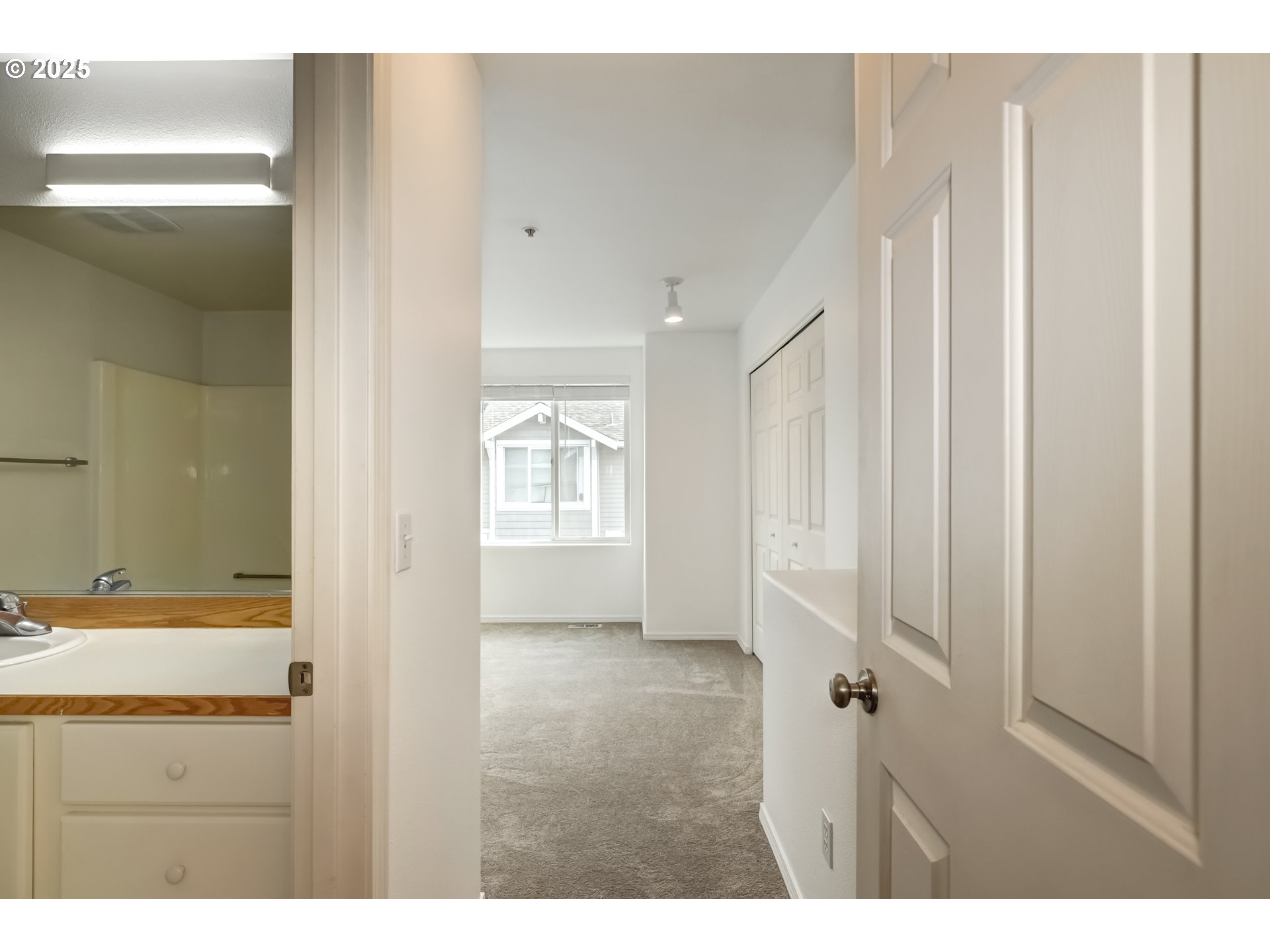 16080 Southwest Audubon Street, Unit 103 Beaverton, OR 97003 - Photo 14 of 24 a bathroom with a sink and a mirror