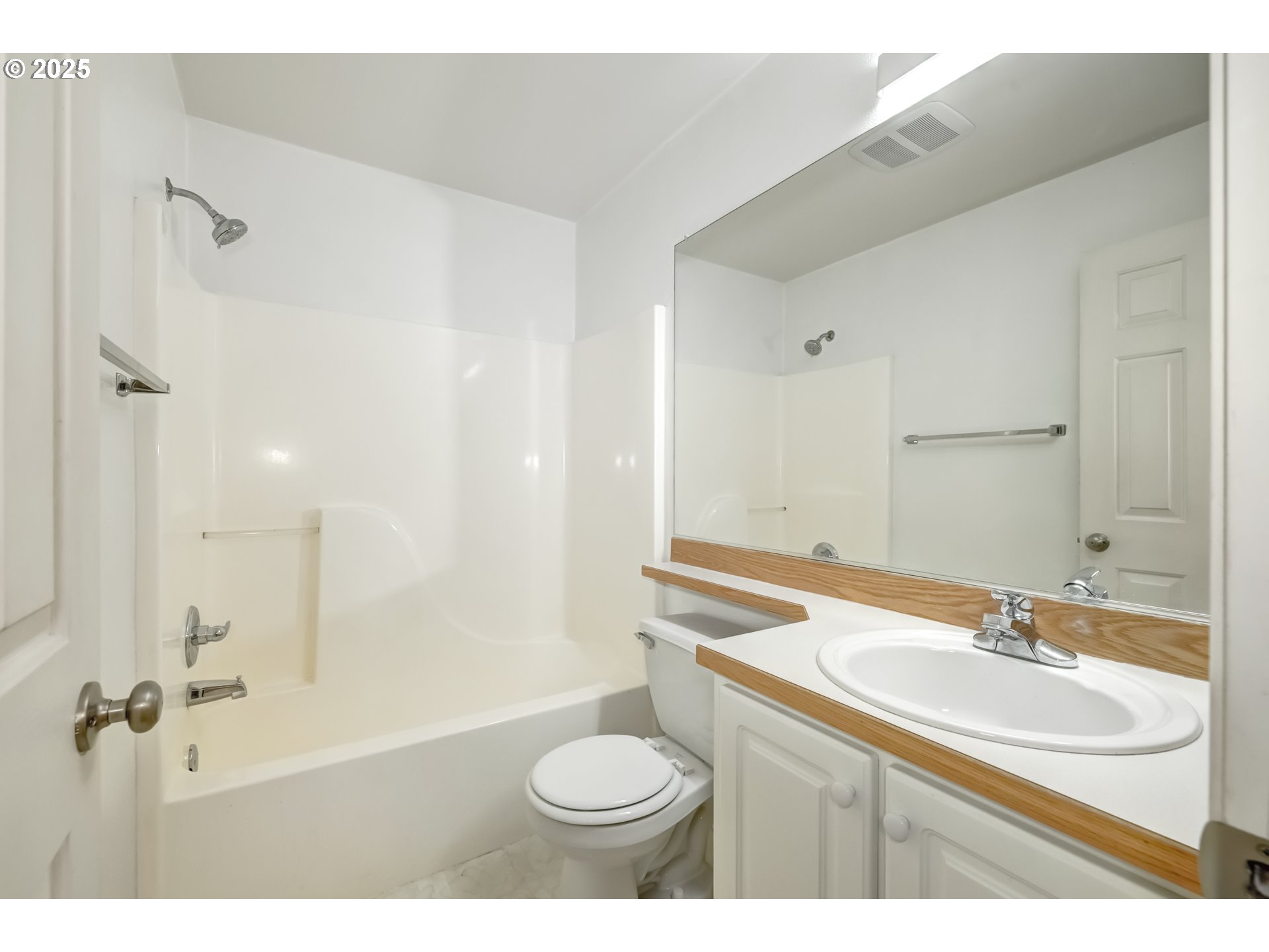 16080 Southwest Audubon Street, Unit 103 Beaverton, OR 97003 - Photo 19 of 24 a bathroom with a sink shower and a toilet