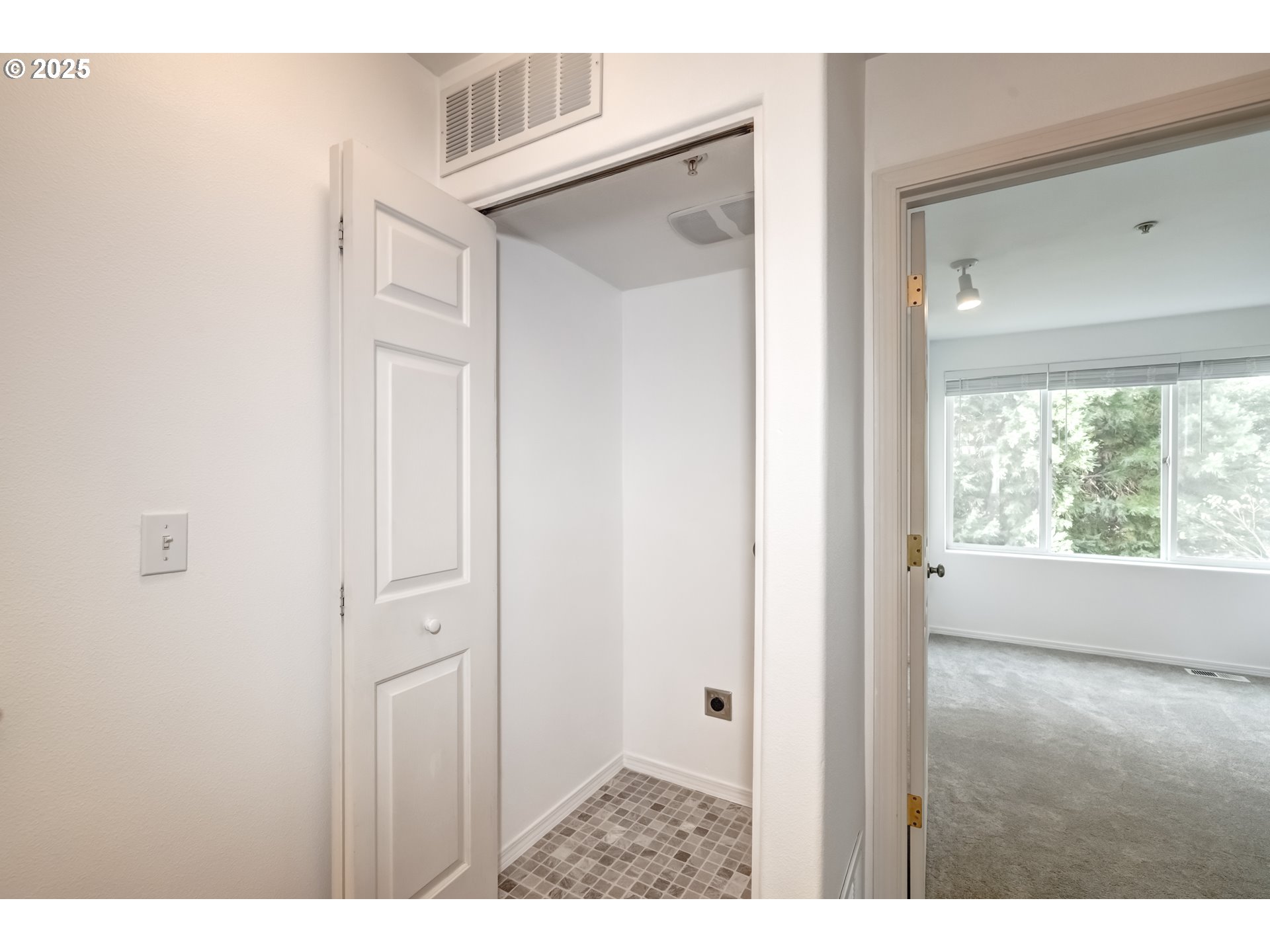 16080 Southwest Audubon Street, Unit 103 Beaverton, OR 97003 - Photo 20 of 24 a view of an entryway with wooden floor