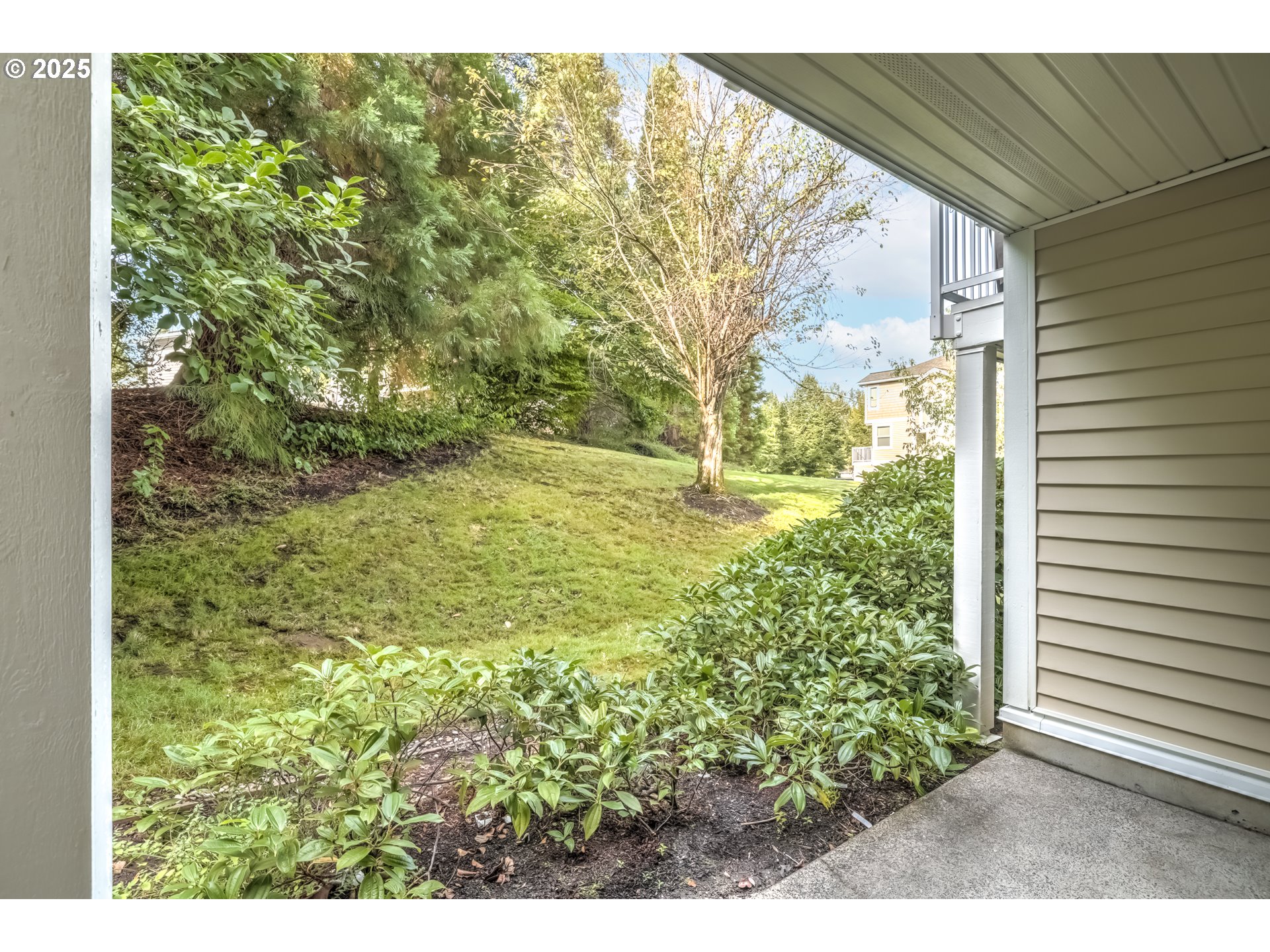 16080 Southwest Audubon Street, Unit 103 Beaverton, OR 97003 - Photo 23 of 24 a view of a yard with an outdoor space