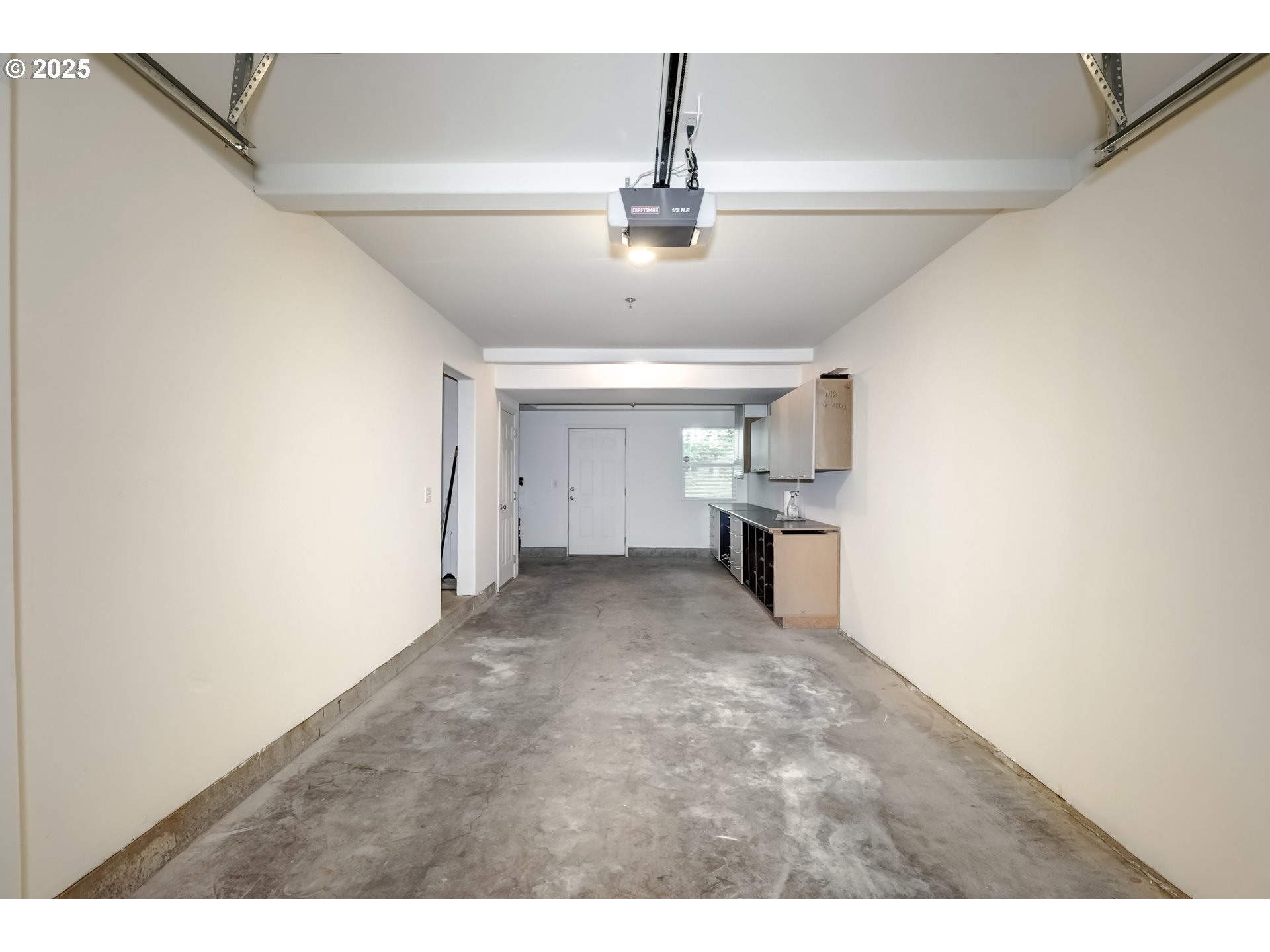 16080 Southwest Audubon Street, Unit 103 Beaverton, OR 97003 - Photo 24 of 24 a view of a hallway with a kitchen