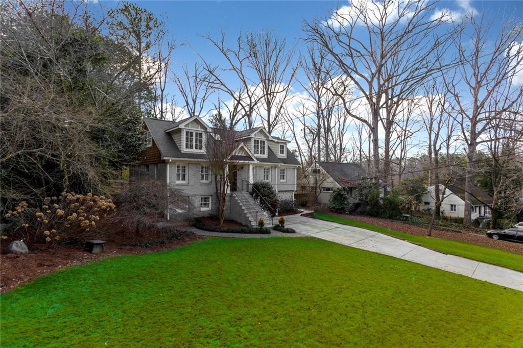 a front view of a house with garden