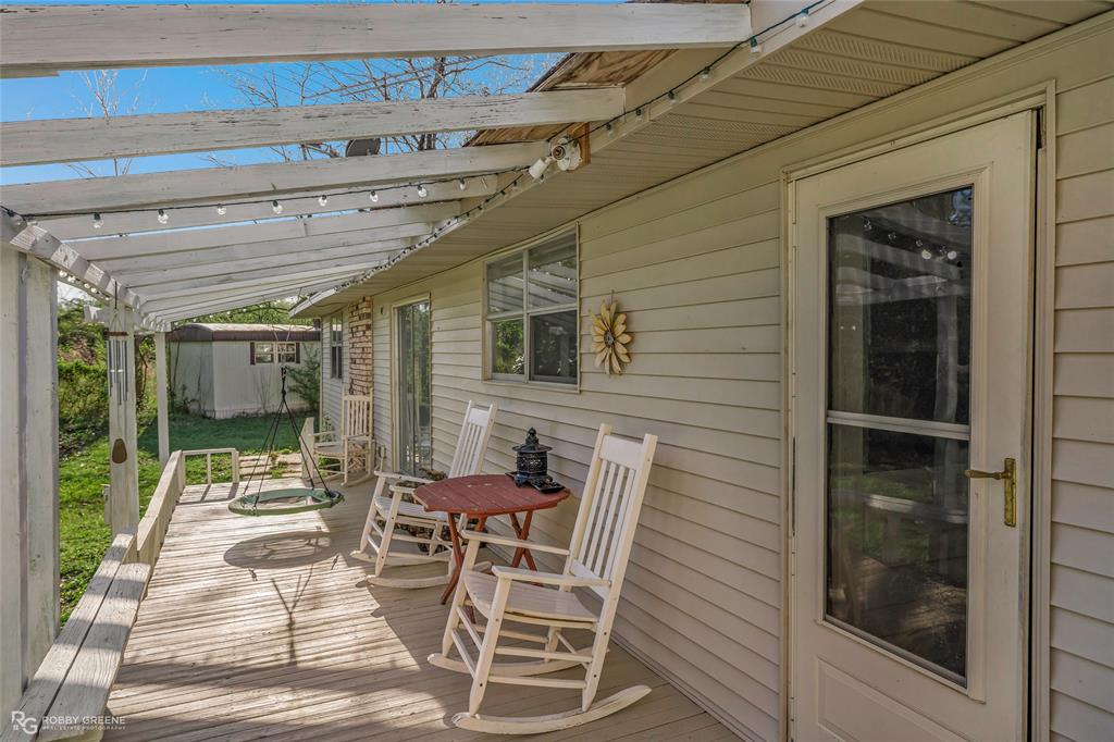 251 Tom Murphy Road Jamestown, LA 71045 - Photo 9 of 40 a view of a patio with table and chairs and potted plants