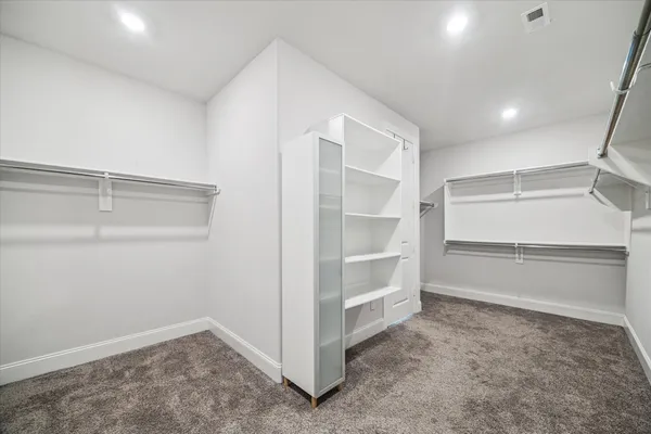 a view of an empty walk in closet