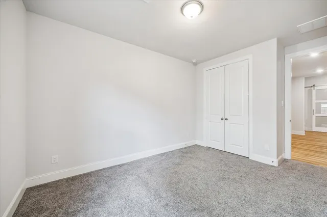 a view of an empty room and entryway