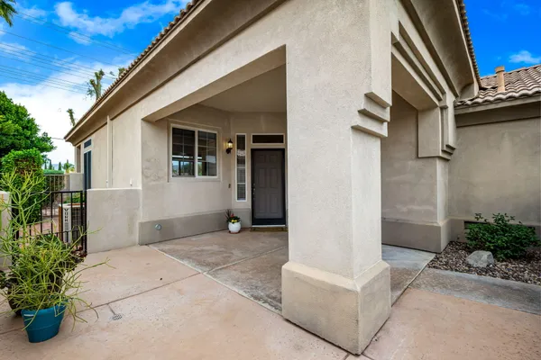 a view of backyard with patio