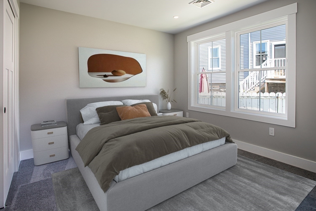 337 Danforth Street, Unit 7 Fall River, MA 02720 - Photo 23 of 28 a bedroom with a bed and a large window