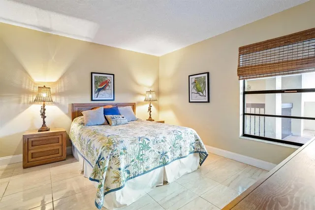 a bedroom with a bed and a cabinets