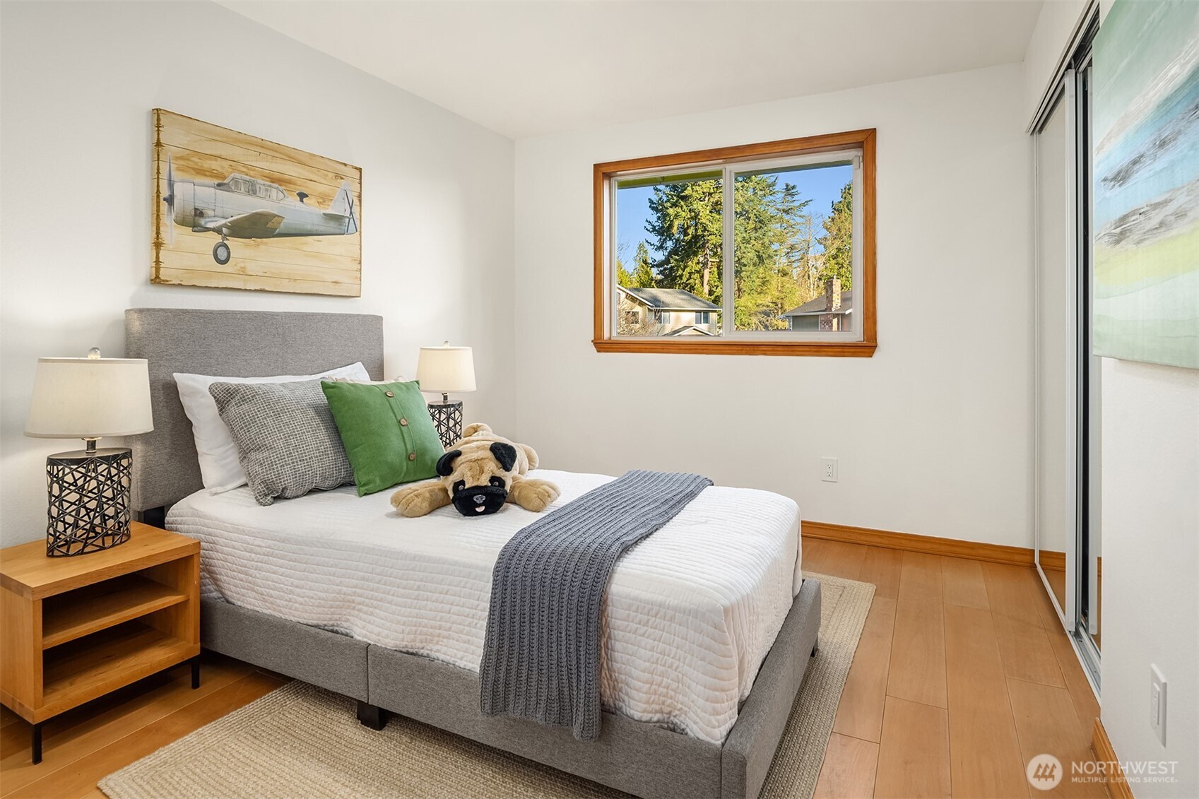 14410 48th Place West Edmonds, WA 98026 - Photo 12 of 24 a bedroom with bed and wall painting with wooden floor
