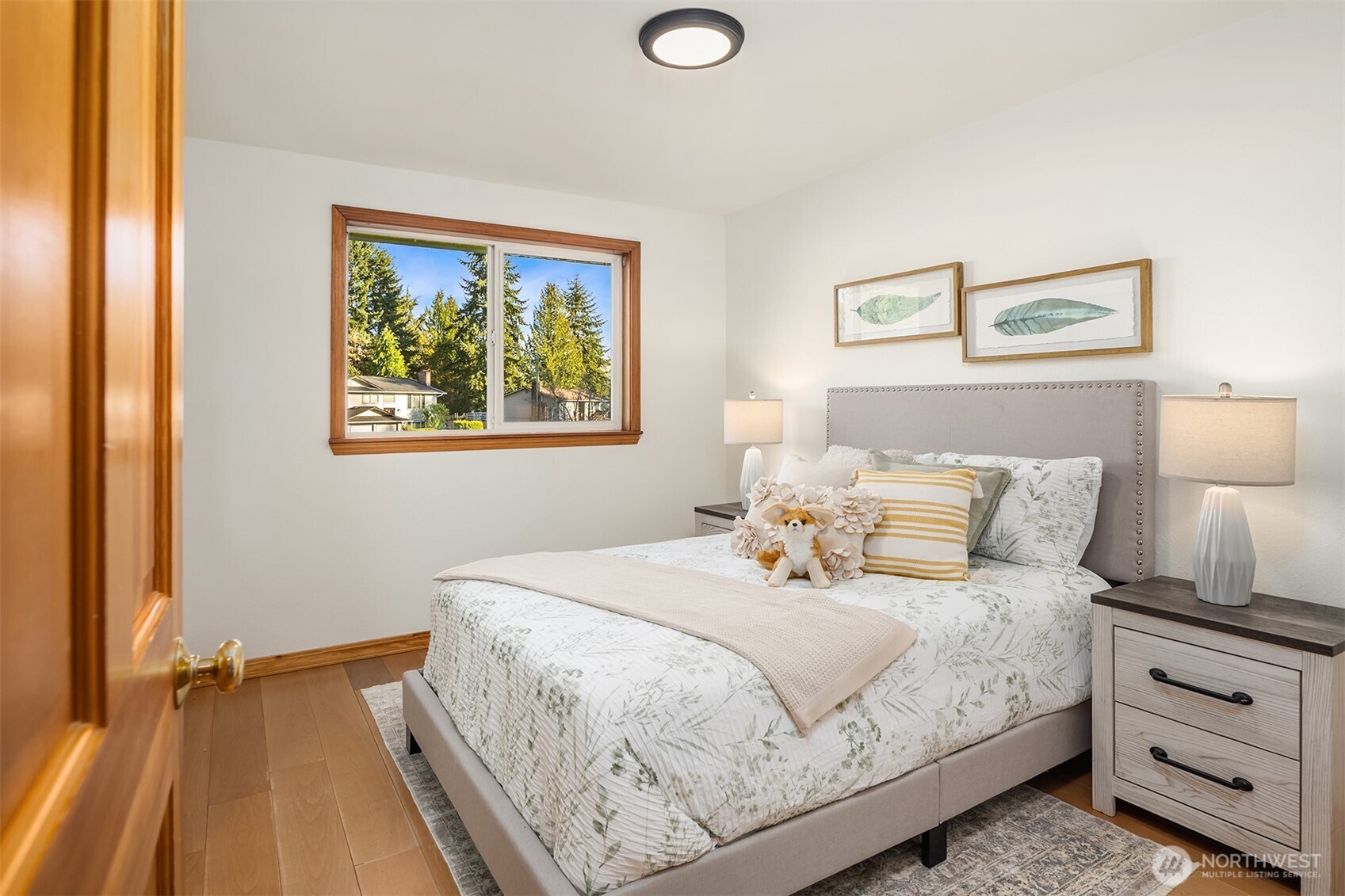 14410 48th Place West Edmonds, WA 98026 - Photo 13 of 24 a bedroom with a bed and a painting on the wall