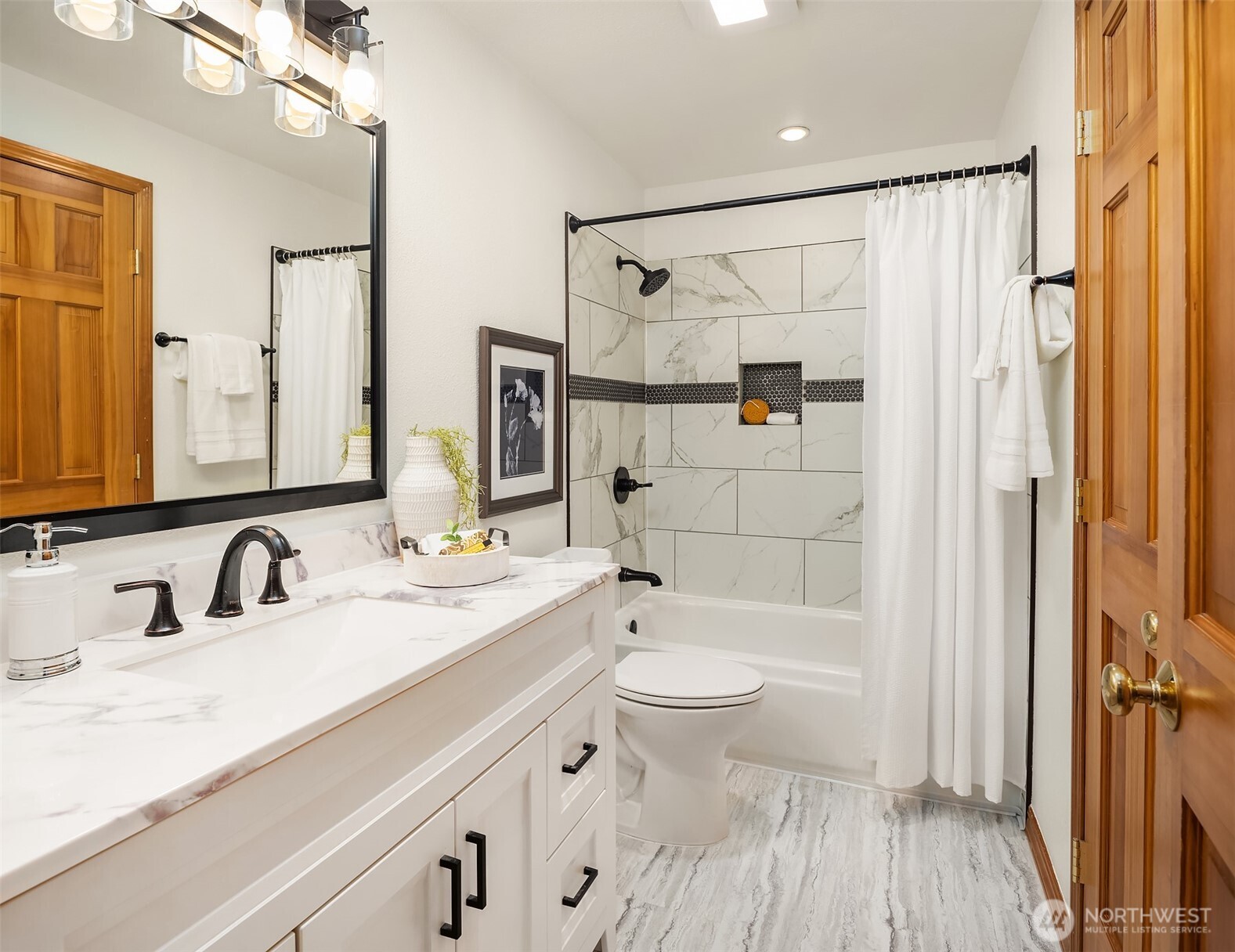 14410 48th Place West Edmonds, WA 98026 - Photo 14 of 24 a bathroom with a sink a toilet and shower