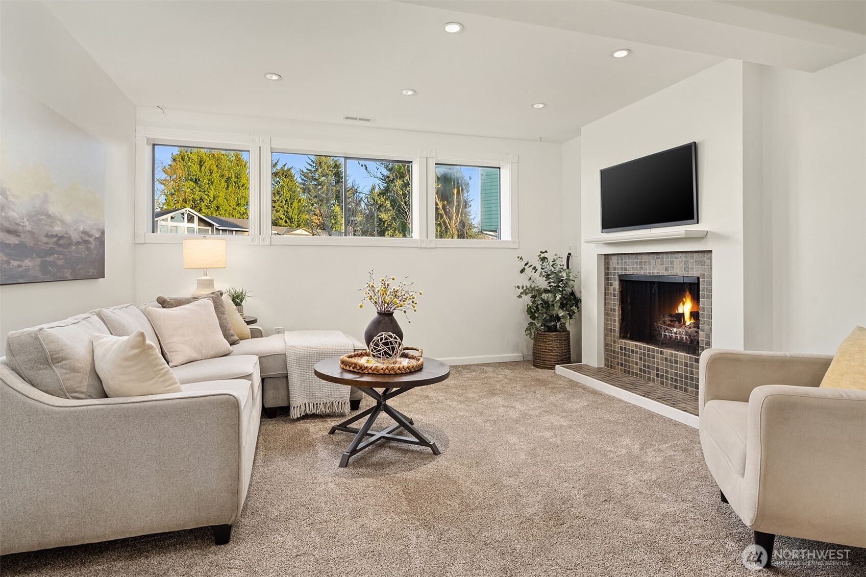14410 48th Place West Edmonds, WA 98026 - Photo 15 of 24 a living room with furniture a flat screen tv and a fireplace