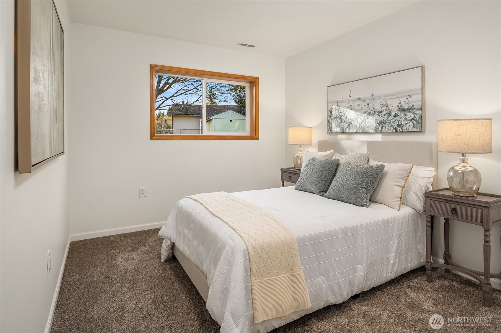 14410 48th Place West Edmonds, WA 98026 - Photo 17 of 24 a bedroom with a bed and a painting on the wall