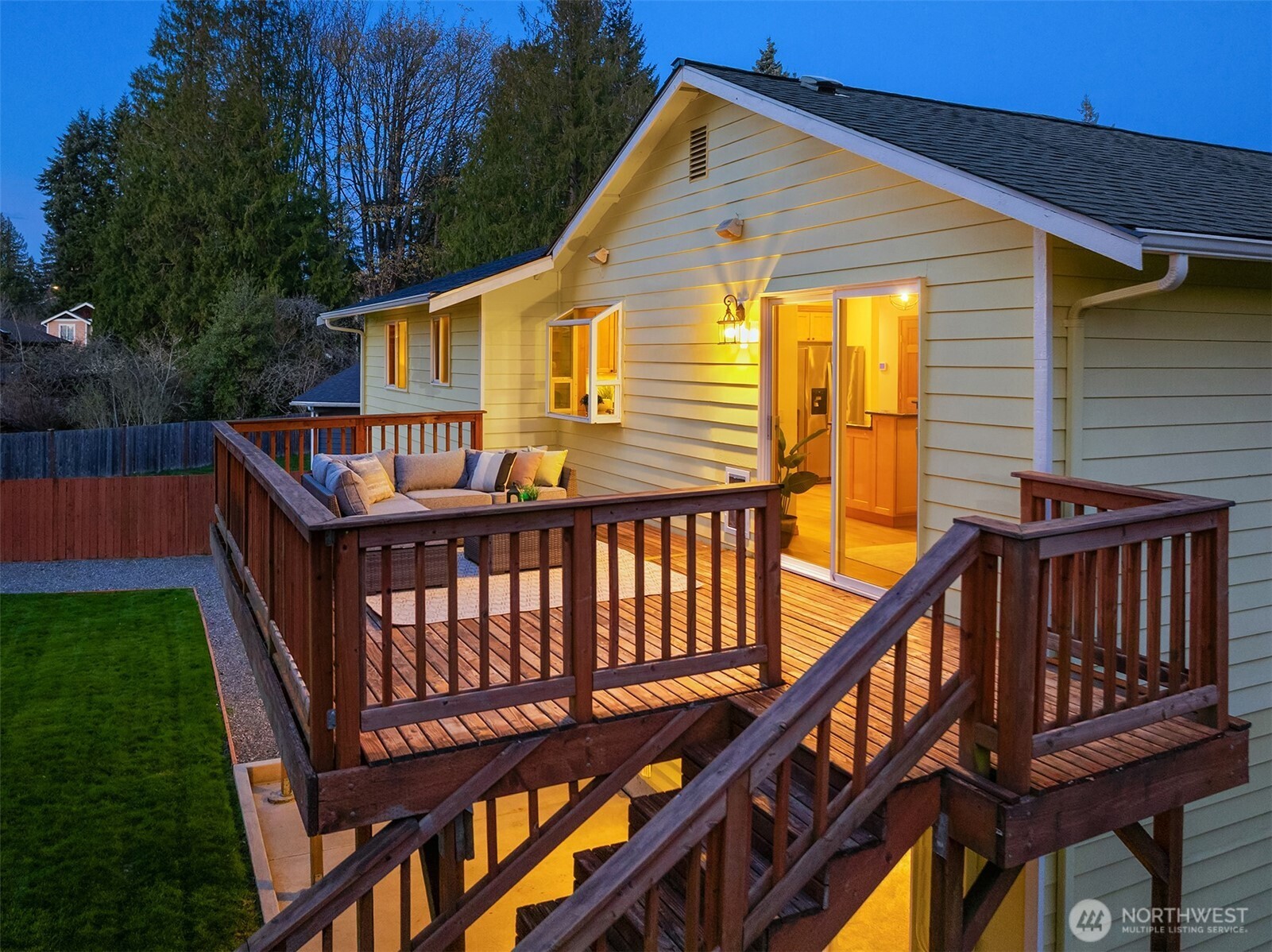 14410 48th Place West Edmonds, WA 98026 - Photo 2 of 24 a view of a wooden chairs and deck in the backyard