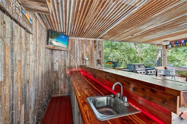 a sitting area with swimming pool and outdoor space