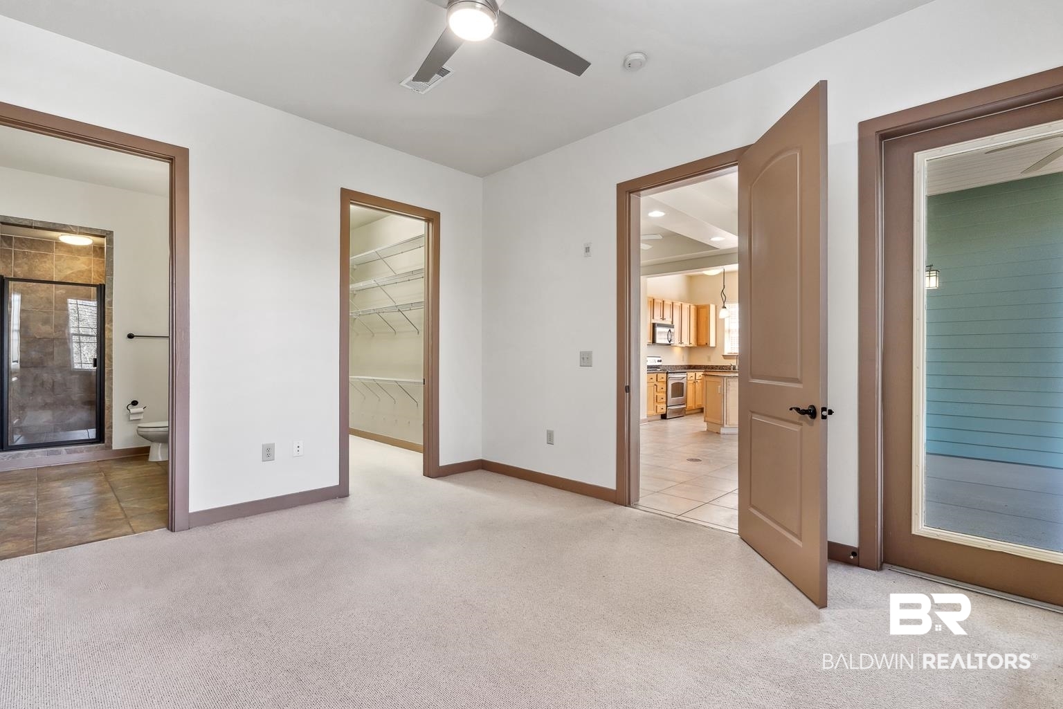 1430 Regency Road, Unit H201 Gulf Shores, AL 36542 - Photo 28 of 49 Unfurnished room featuring light carpet, a ceiling fan, visible vents, and baseboards