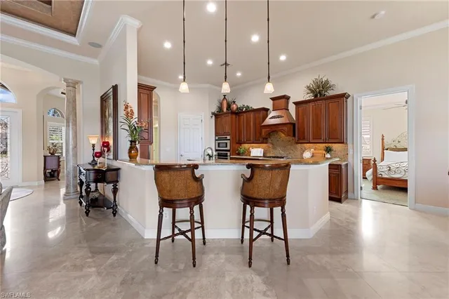 a view of kitchen with furniture and wooden floor