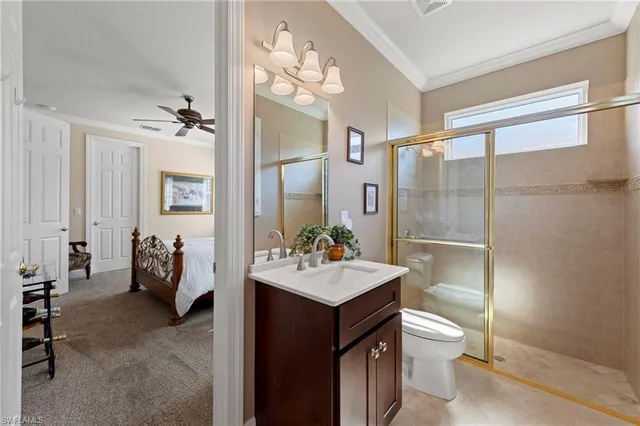 a bathroom with a sink double vanity and a toilet