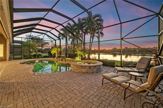 a view of swimming pool with outdoor seating