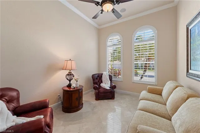a living room with furniture a window and gym equipment