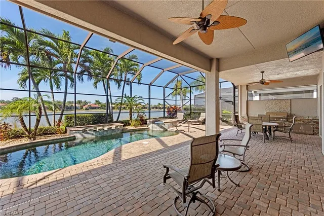 a view of a swimming pool with a patio