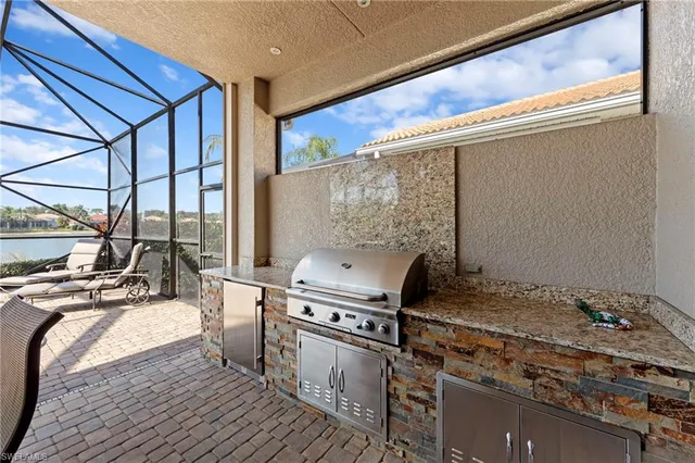 a kitchen with a stove and a wooden floor