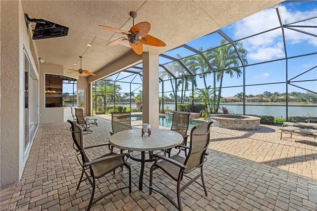 a view of a patio with a table and chairs
