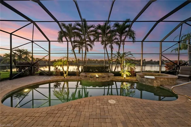 a view of a swimming pool with a patio