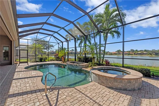 a view of a swimming pool with a patio
