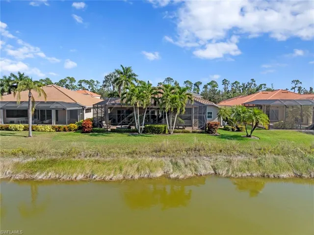 a swimming pool with outdoor seating and yard