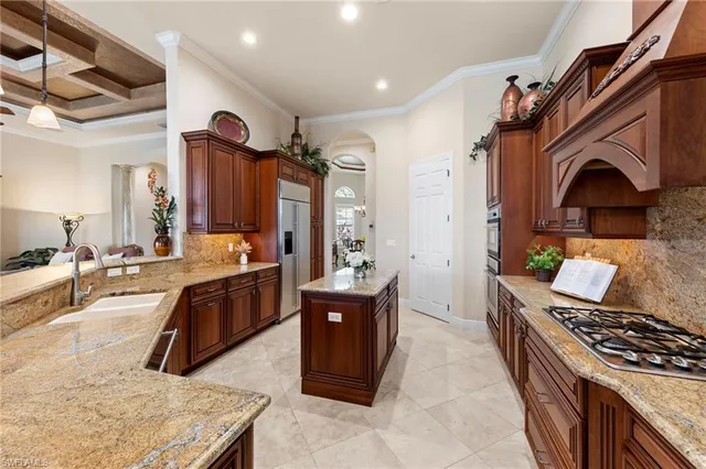 a kitchen with stainless steel appliances granite countertop a stove and a refrigerator