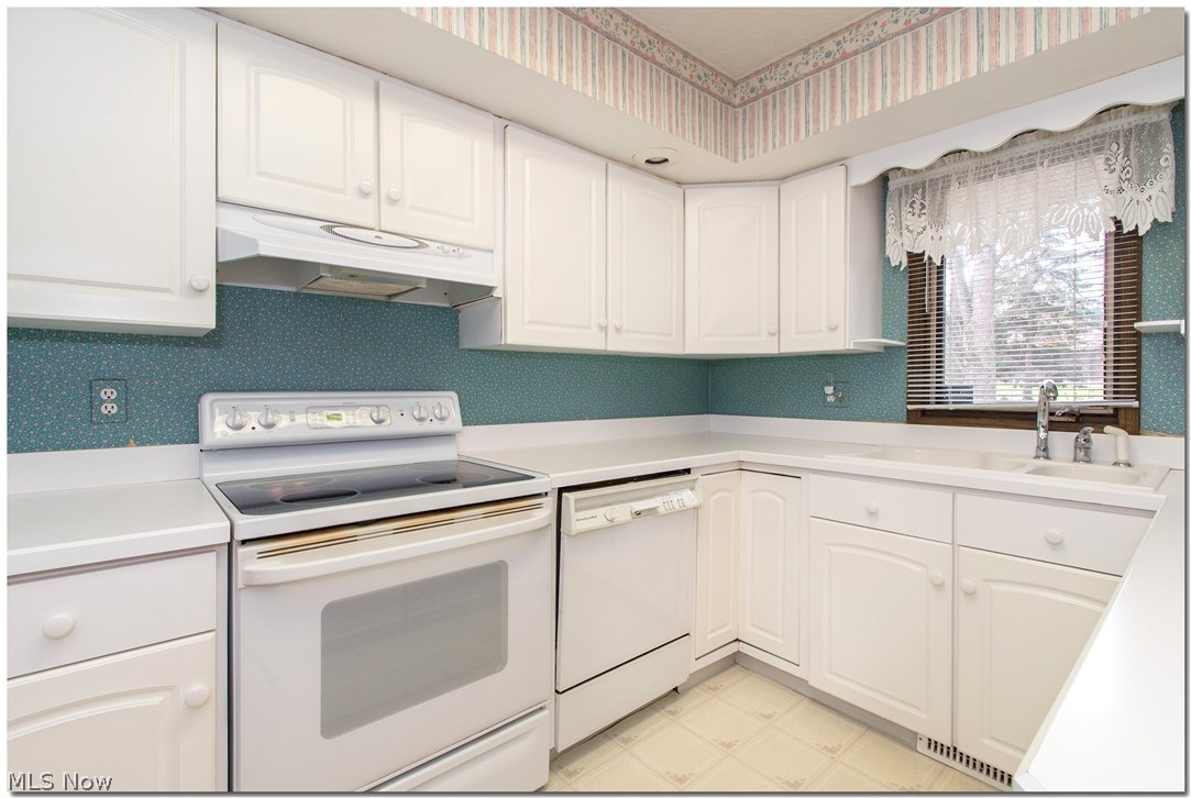 5095 Som Center Road Solon, OH 44139 - Photo 11 of 35 Kitchen has clean white cabinets throughout.