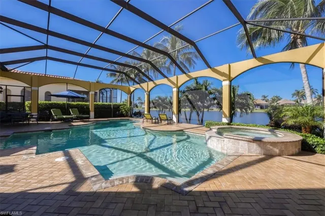 a view of a swimming pool with a patio