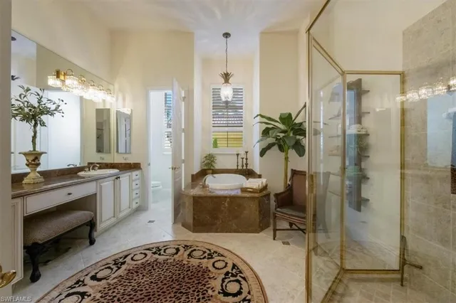 a spacious bathroom with a double vanity sink a large mirror and a shower