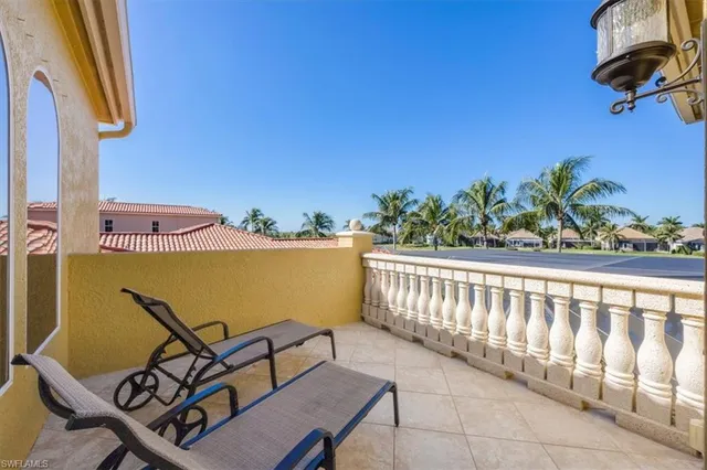 a view of a chairs and table in patio