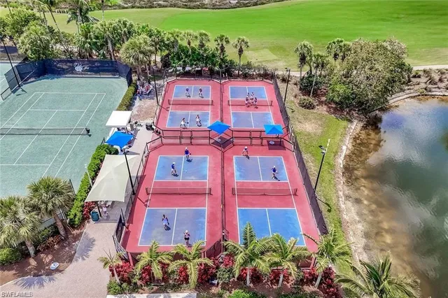 a aerial view of a house with a garden and lake view