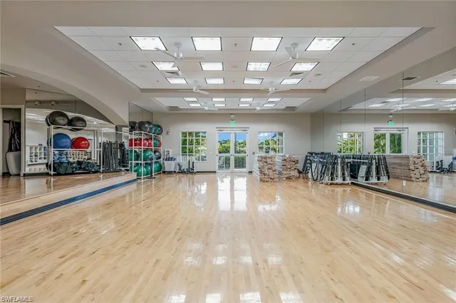 a view of a room with lots of furniture and a chandelier