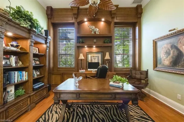 a view of a house with pool table and chairs