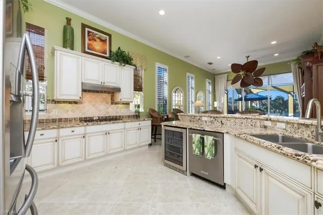 a kitchen with stainless steel appliances granite countertop a stove and a sink