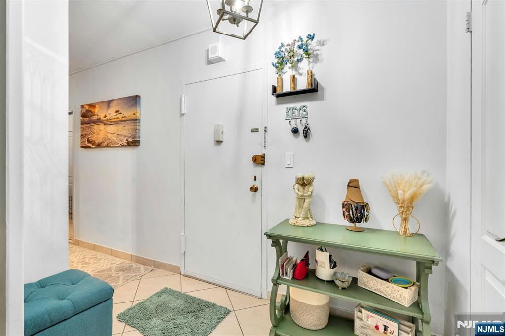 1375 River, Unit LG Edgewater, NJ 07020 - Photo 12 of 18 a bathroom with a sink mirror and toilet