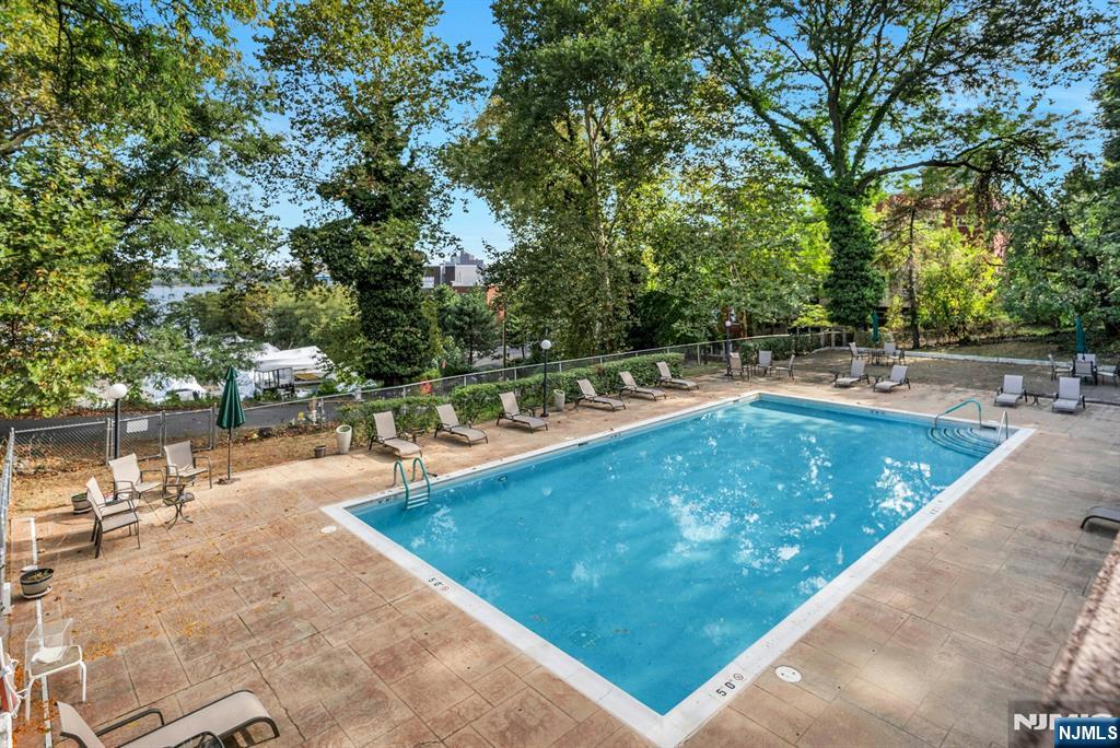 1375 River, Unit LG Edgewater, NJ 07020 - Photo 17 of 18 a view of a swimming pool with a patio