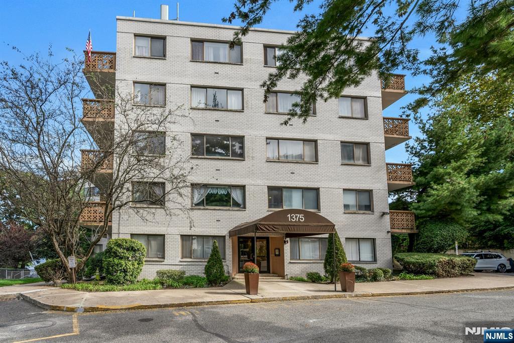 1375 River, Unit LG Edgewater, NJ 07020 - Photo 2 of 18 a front view of a building and a street