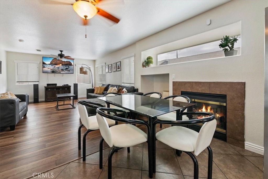 16220 Vía Ultimo Moreno Valley, CA 92551 - Photo 18 of 38 a living room with furniture and a fireplace