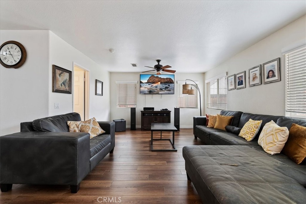 16220 Vía Ultimo Moreno Valley, CA 92551 - Photo 22 of 38 a living room with furniture kitchen view and a window